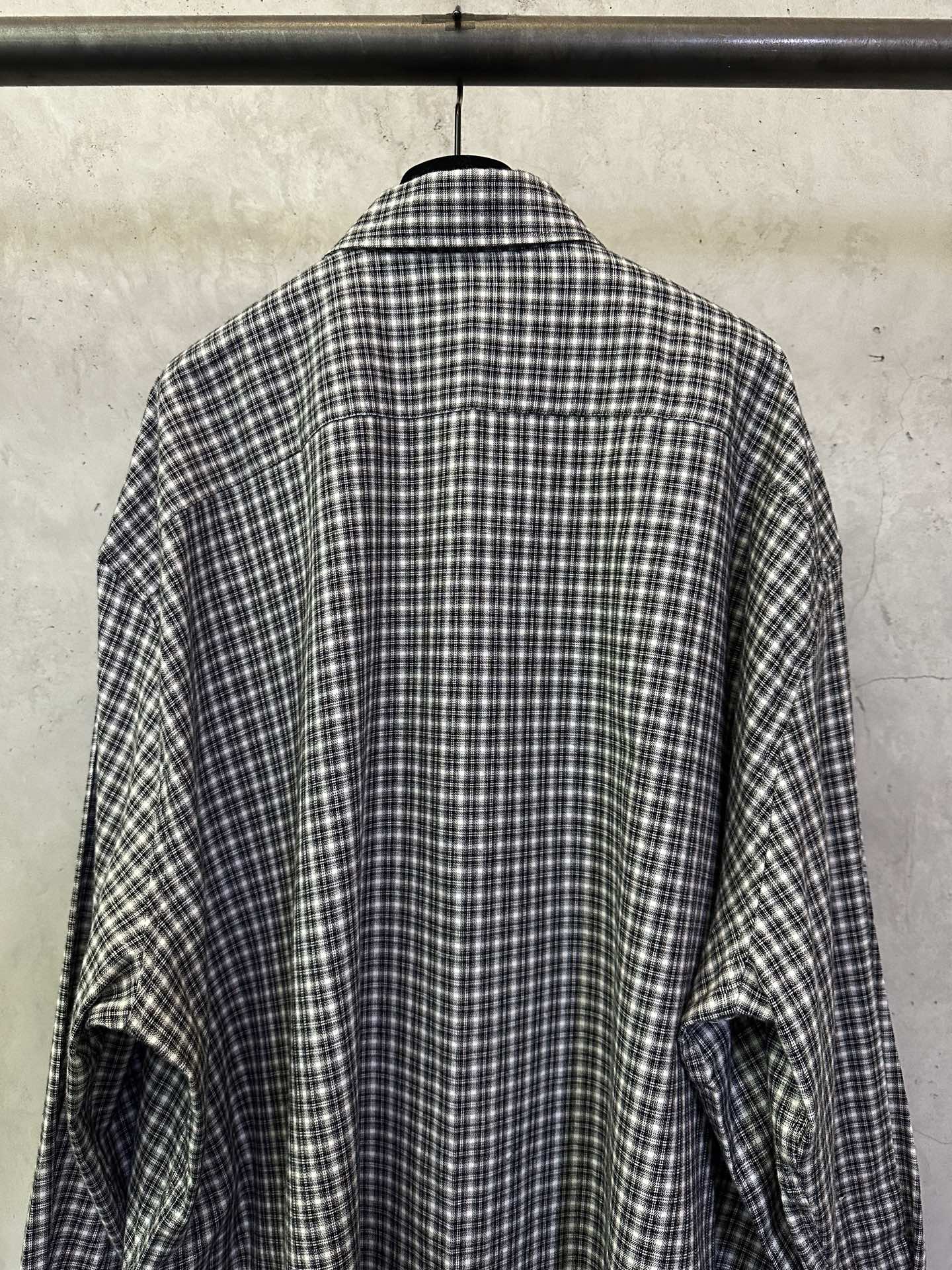 Balenciaga long plaid long-sleeve shirt, back view with rounded hem