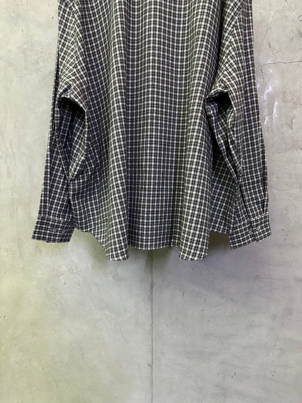 Balenciaga long plaid long-sleeve shirt, side view showing cuffs and hem