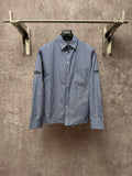 Long-sleeve button-up shirt with vertical blue-and-white stripes, button front, chest pocket.