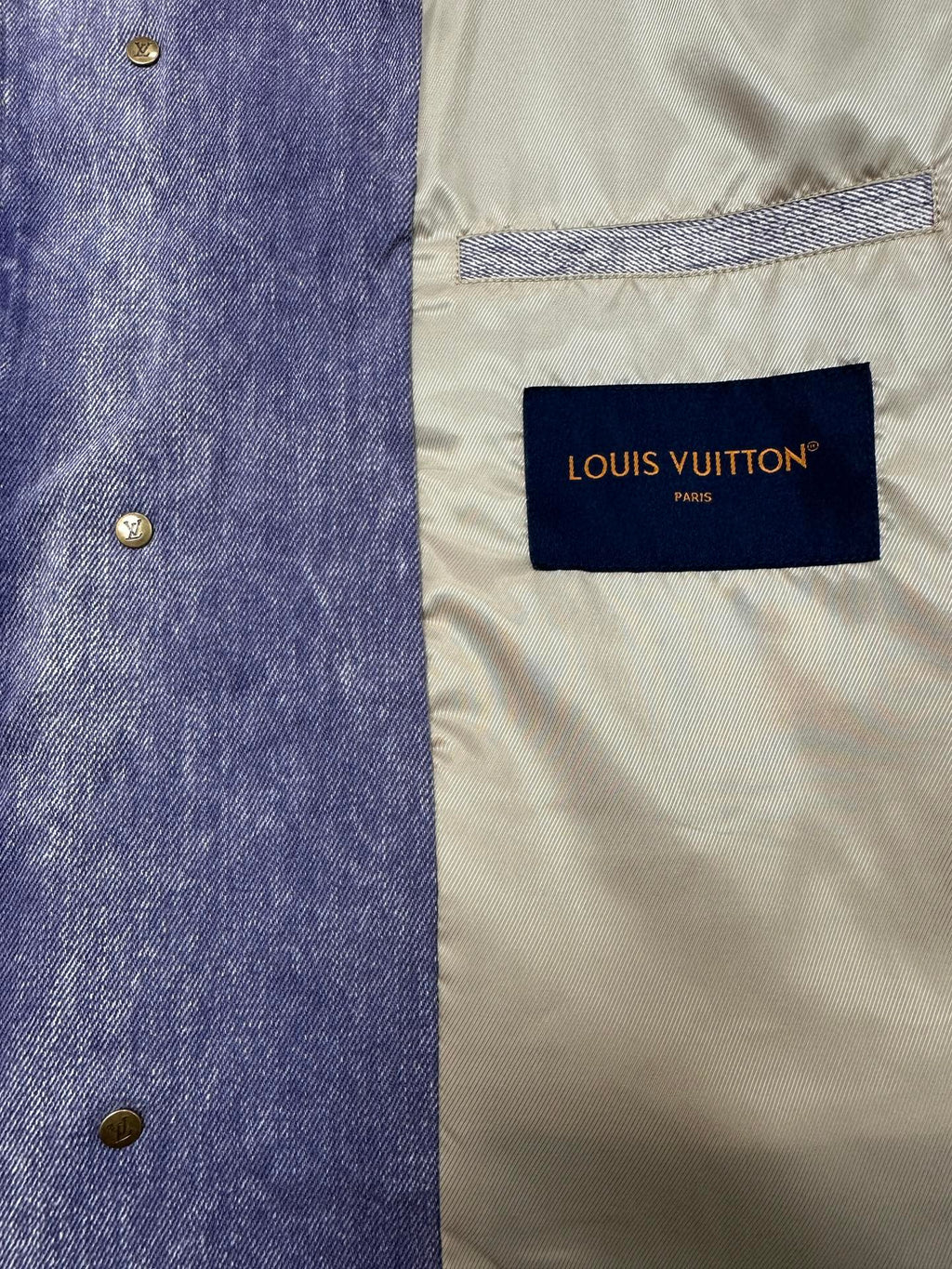 Louis Vuitton denim jacket label on cream inner lining