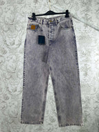 Light wash denim jeans with multiple front pockets and belt loops