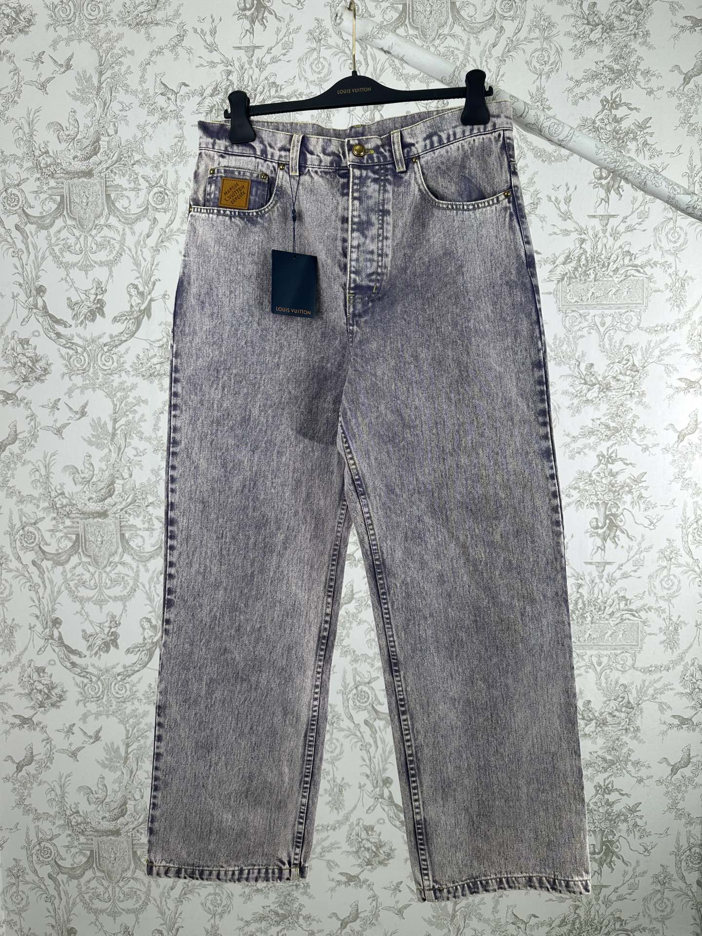 Light blue denim pants with belt loops and front pocket details