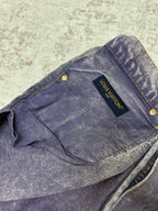 Blue-wash denim jeans with back yoke seam and Louis Vuitton leather tag