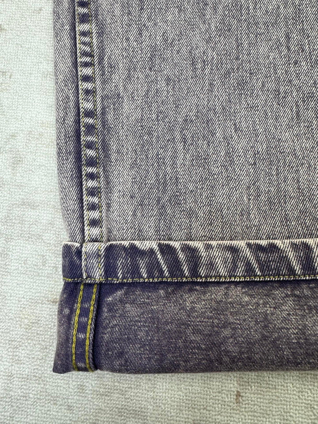 Denim jeans waistband with belt loops and buttoned fly edge