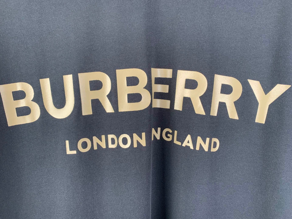 Navy T-shirt with “BURBERRY” and “LONDON ENGLAND” text graphic