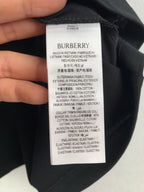 Navy T-shirt inside neck label with Burberry branding and care instructions