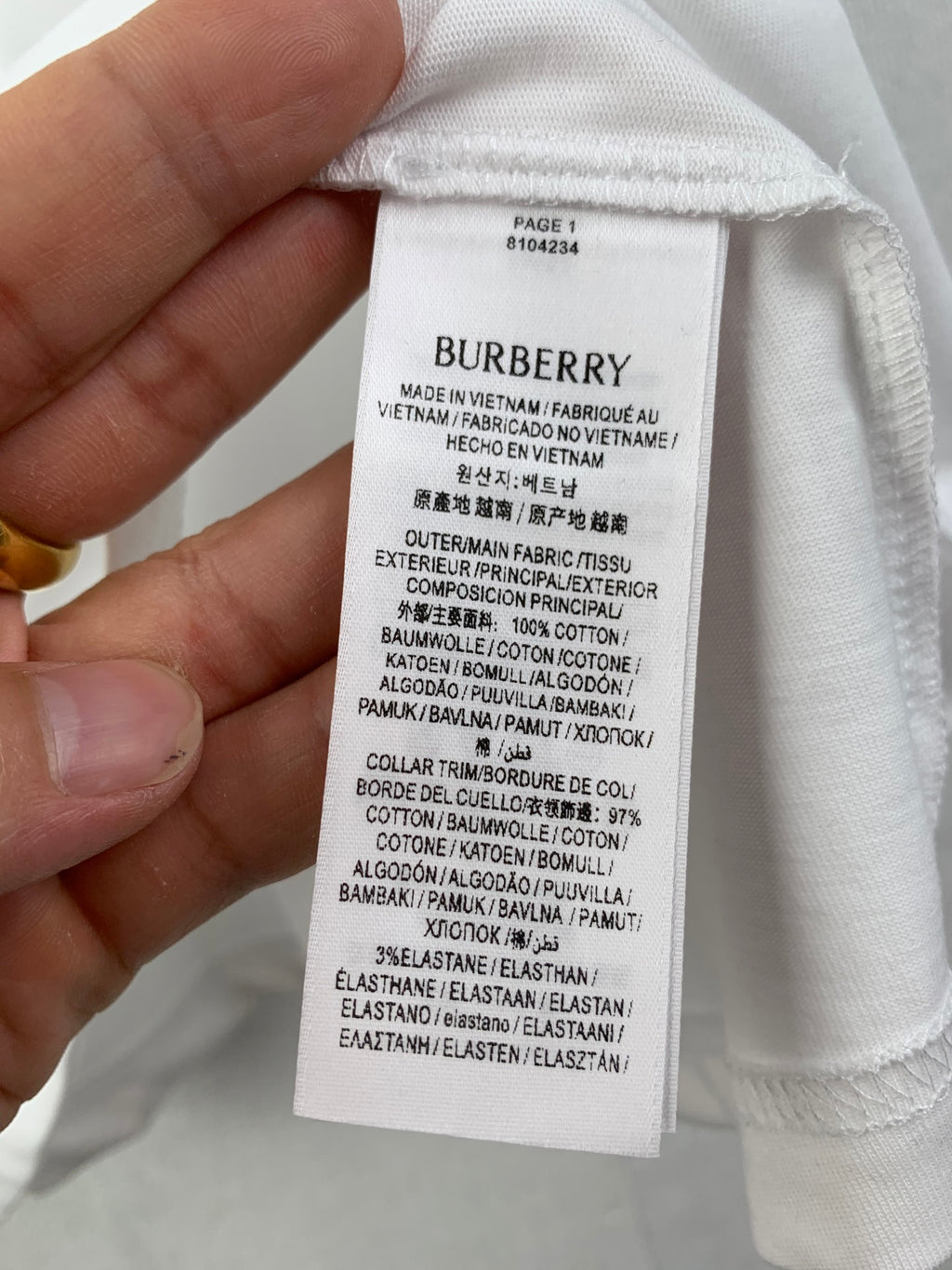 Burberry clothing label on white fabric hem