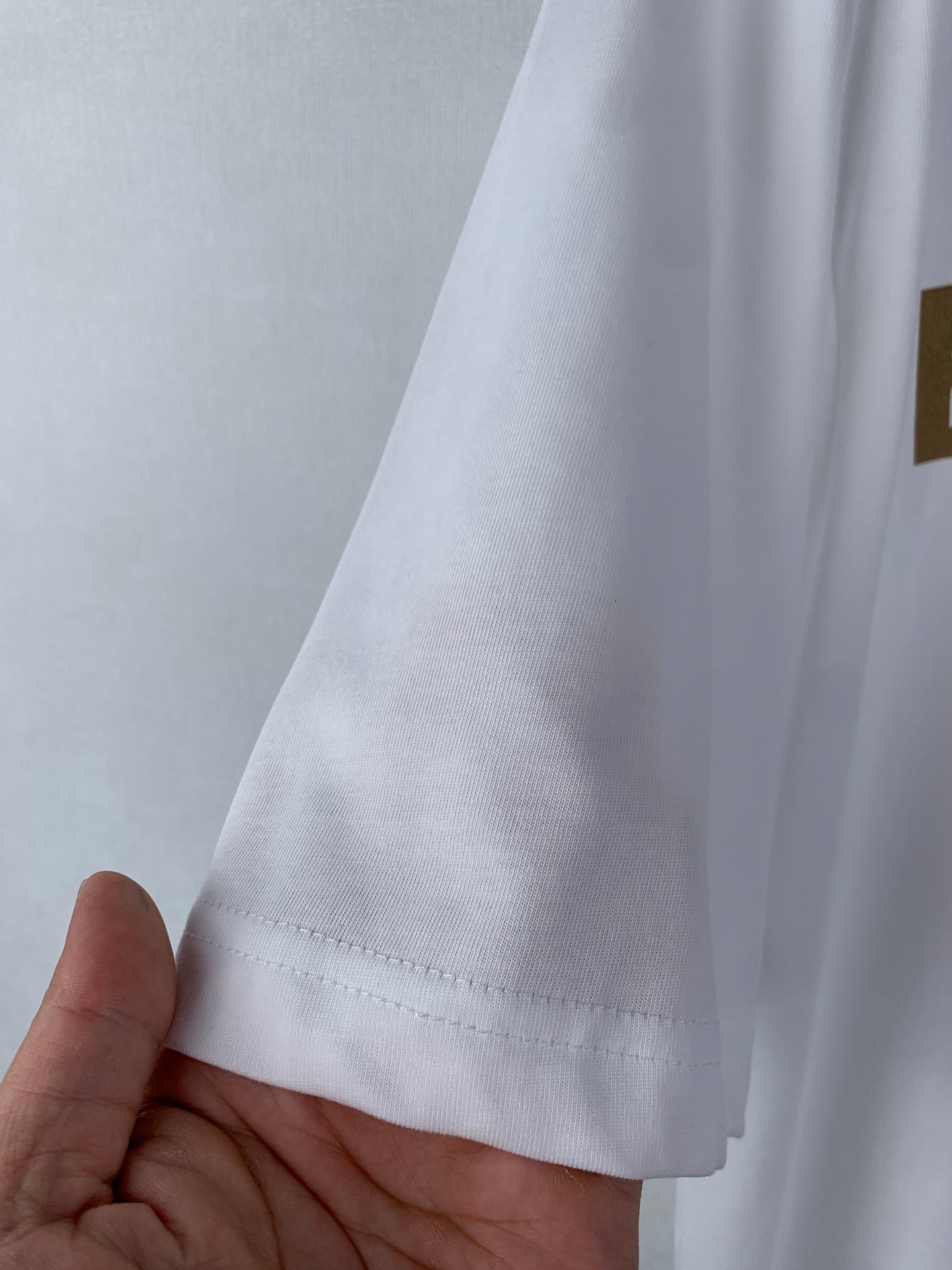 White Burberry T-shirt sleeve hem with stitched cuff detail
