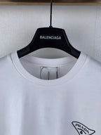 White short-sleeve T-shirt close-up with Prada triangle logo