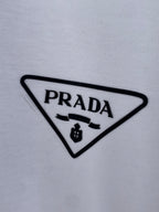 Prada triangle logo patch on white T-shirt