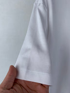 White T-shirt sleeve hem with stitched cuff