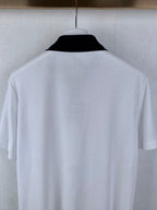 White polo shirt back close-up on hanger