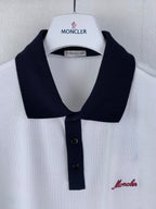 White polo shirt with black collar and front buttons, Moncler badge