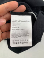 Inside label with size and care symbols on dark polo fabric