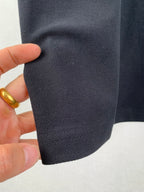 Moncler polo shirt fabric close-up with subtle mesh-like texture