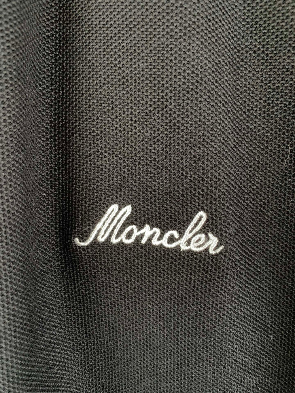Moncler polo shirt fabric with white script logo on chest