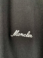 Moncler polo shirt fabric with white script logo on chest