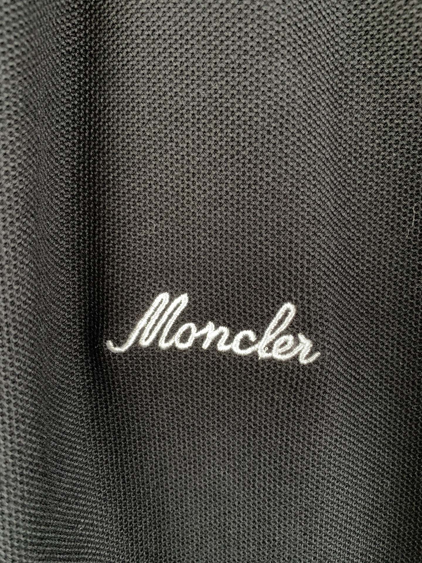 Moncler polo shirt fabric with white script logo on chest
