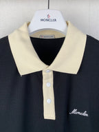Moncler polo shirt close-up at collar, cream placket buttons and logo