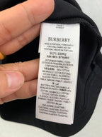 Burberry garment care label with fabric composition and origin text