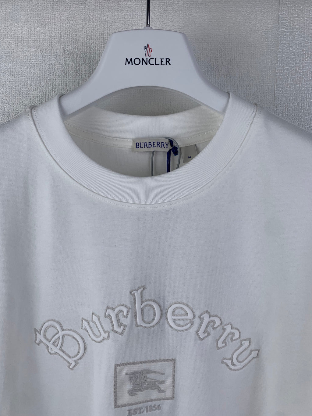 White T-shirt with collar label and Burberry logo, small crest graphic