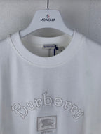 White T-shirt with collar label and Burberry logo, small crest graphic