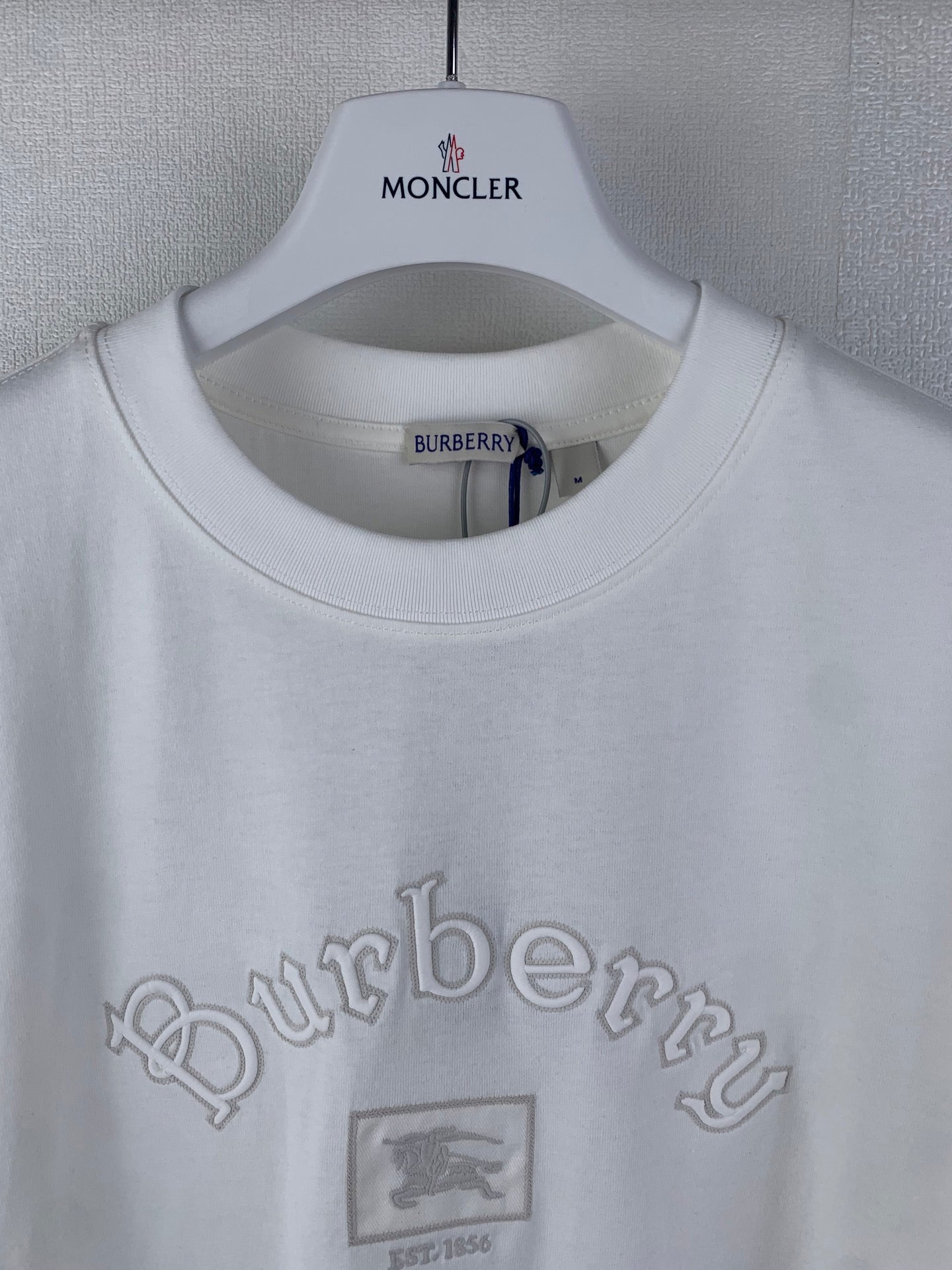 White T-shirt with collar label and Burberry logo, small crest graphic