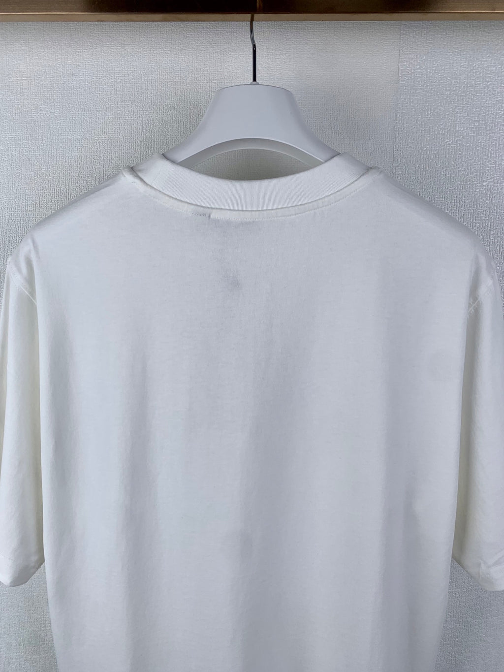White T-shirt back with crew neckline, no visible graphic
