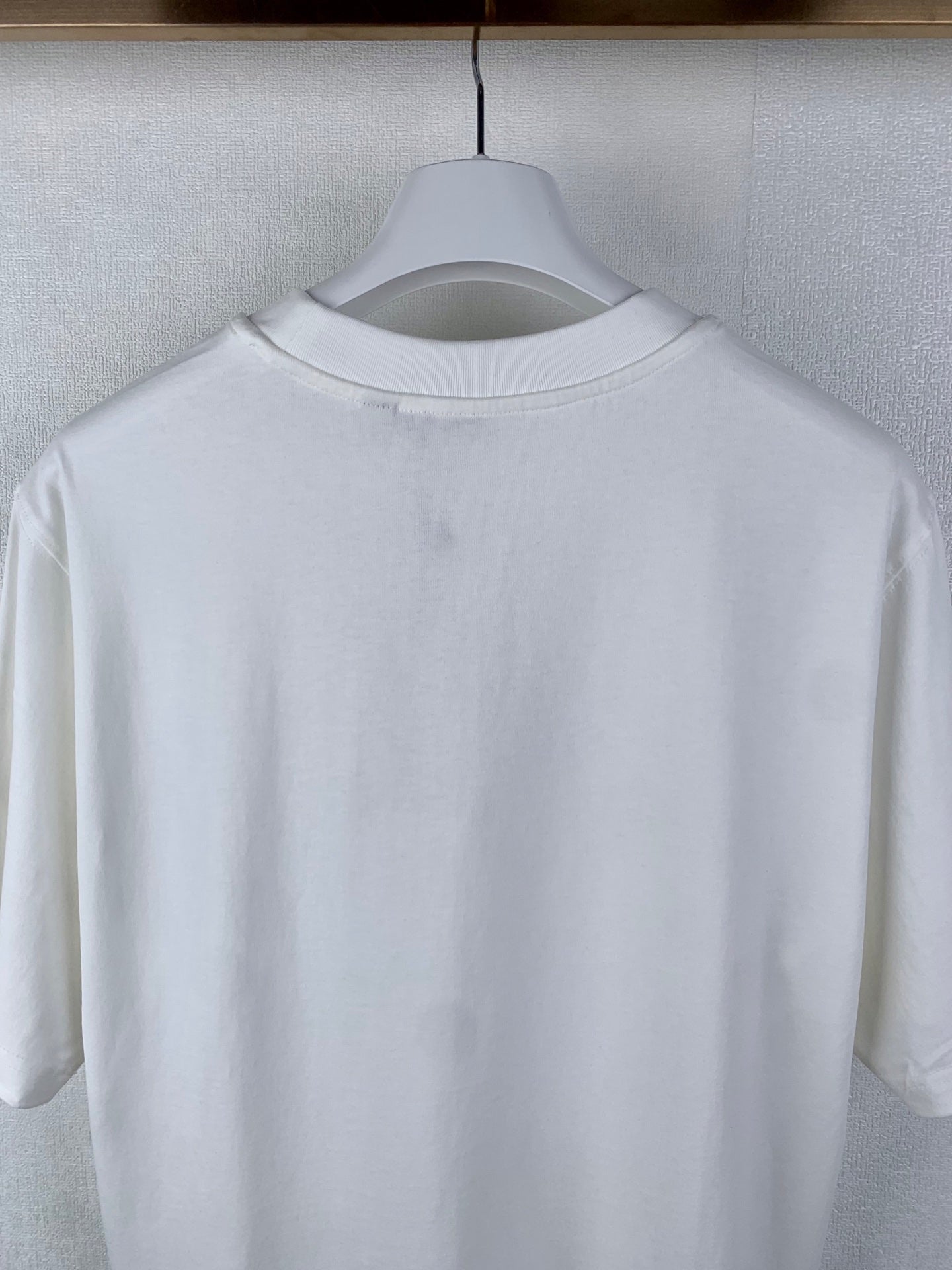 White T-shirt back with crew neckline, no visible graphic