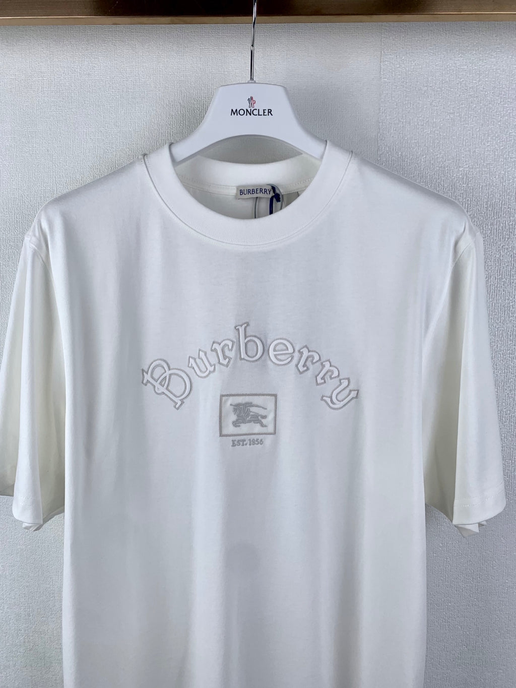 White T-shirt with MONCLER neck label and Burberry logo at chest