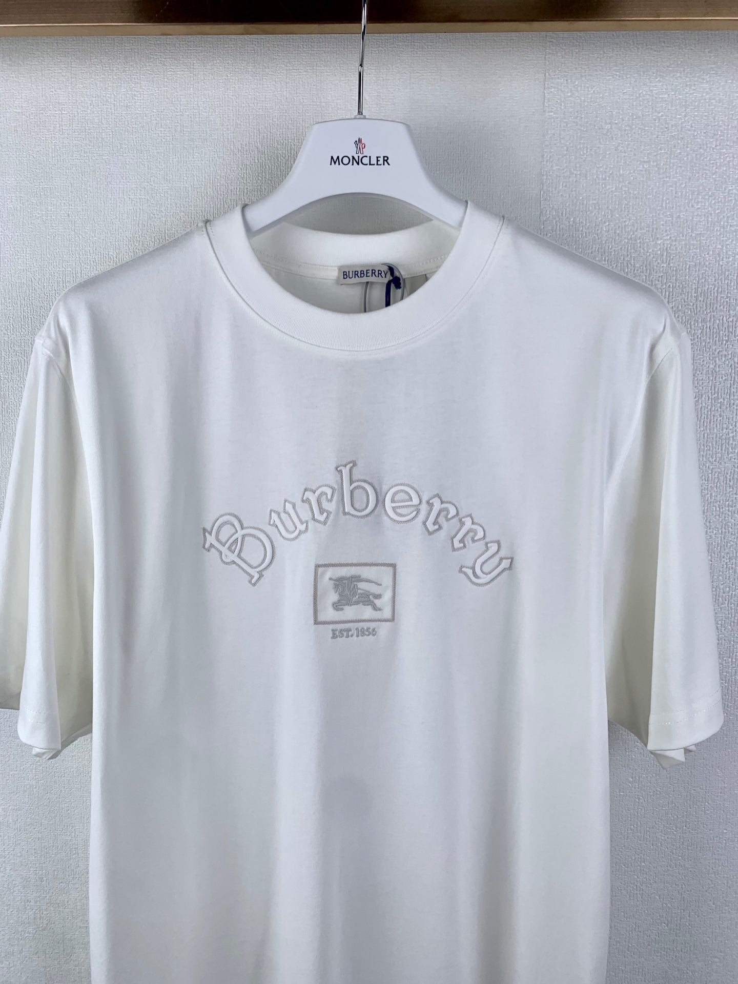 White T-shirt with MONCLER neck label and Burberry logo at chest