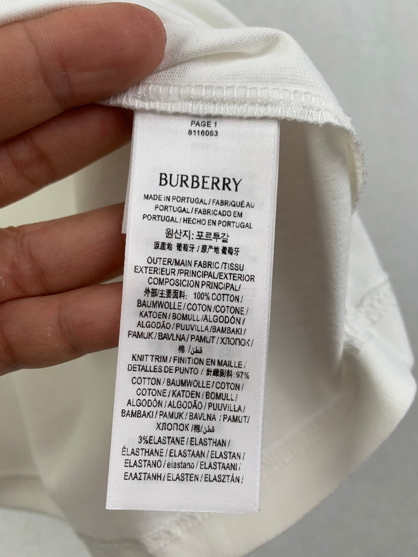 White T-shirt interior care label with Burberry and fabric composition info