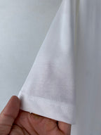 White T-shirt sleeve hem with visible stitching