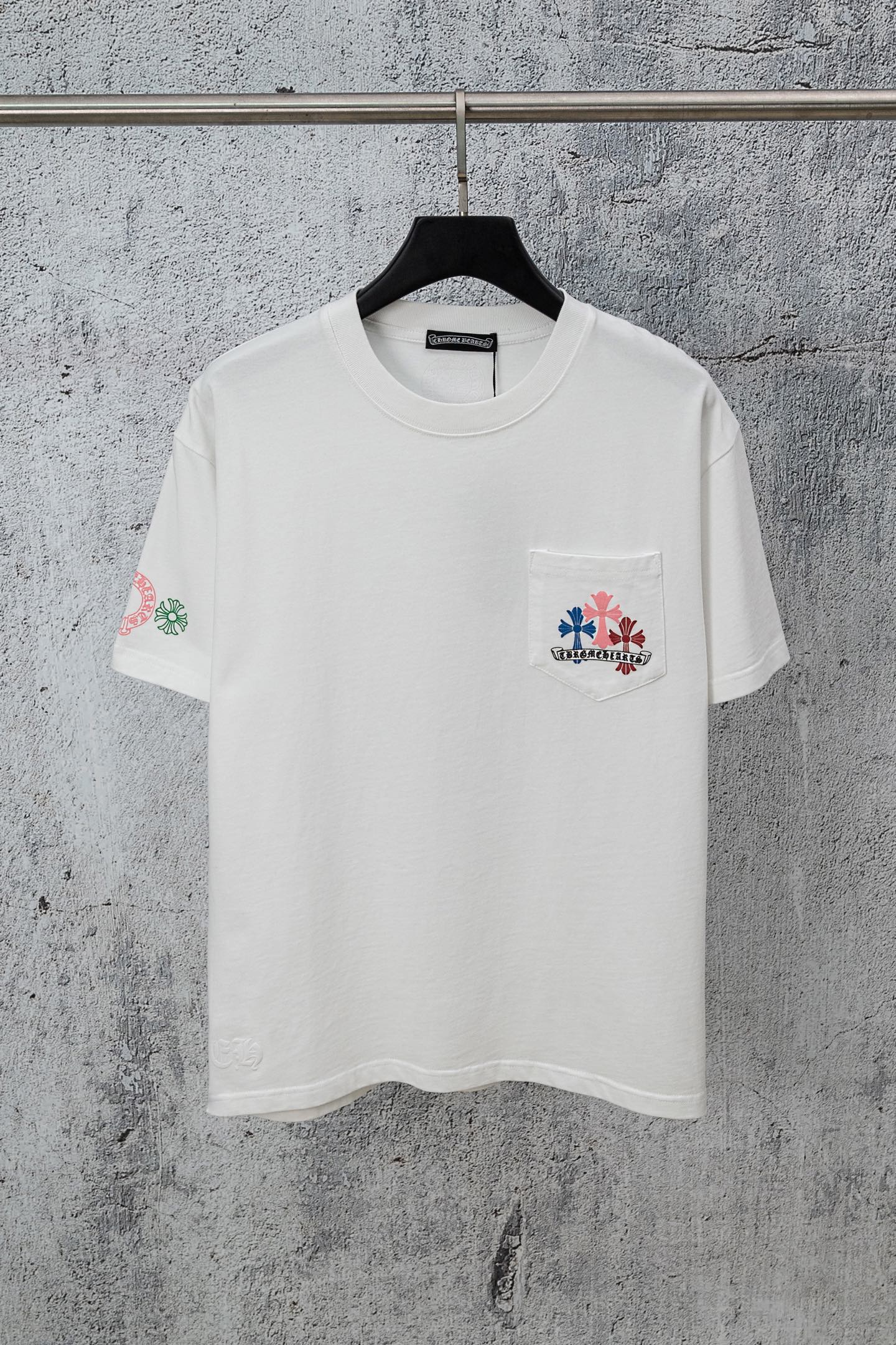 Chrome short T-shirt, white crewneck with chest pocket logo and small left sleeve graphic