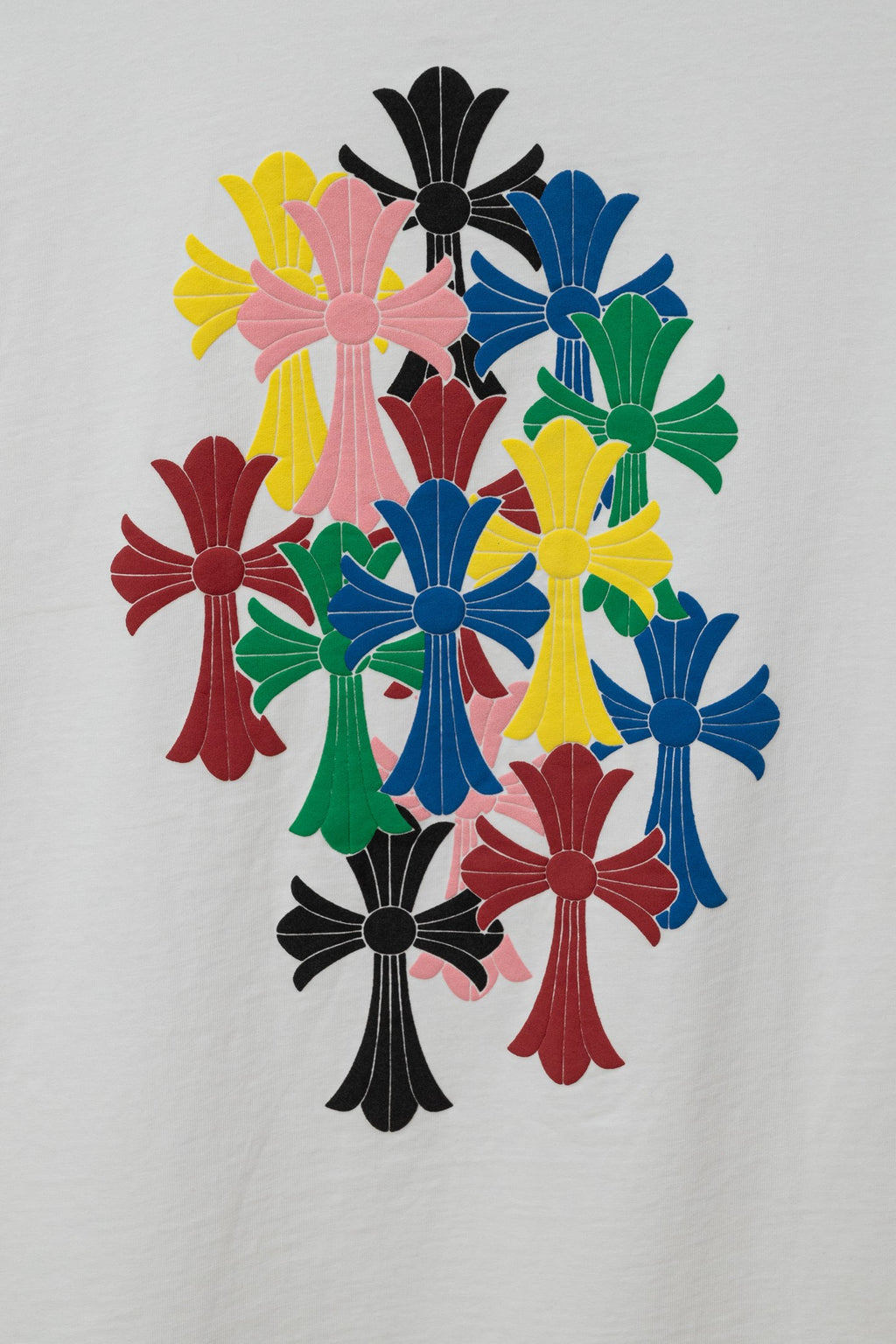 Chrome short T-shirt graphic, colorful cross-flower design in yellow, pink, blue, and red