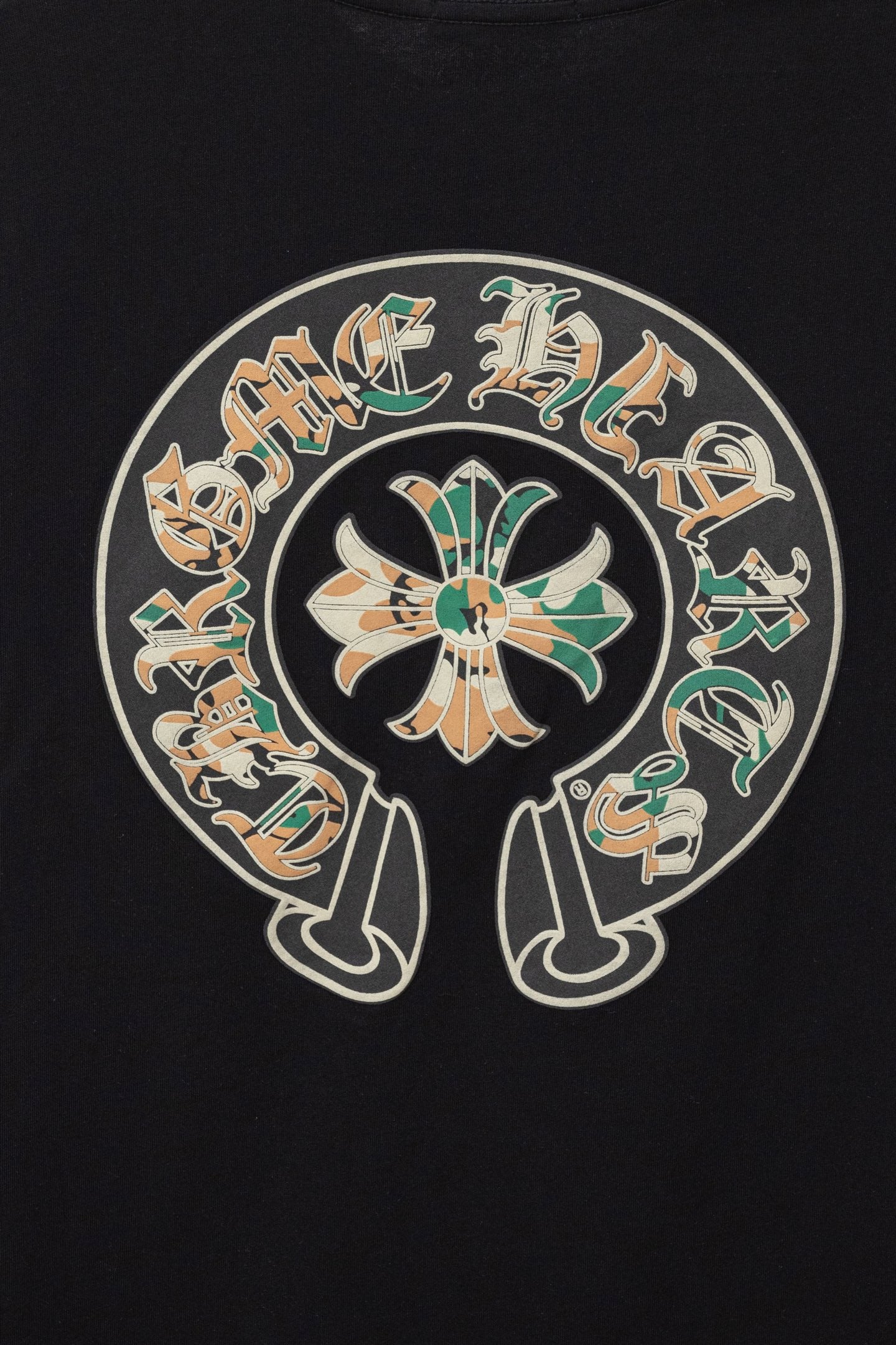 Black short-sleeve T-shirt close-up of large round multicolor graphic