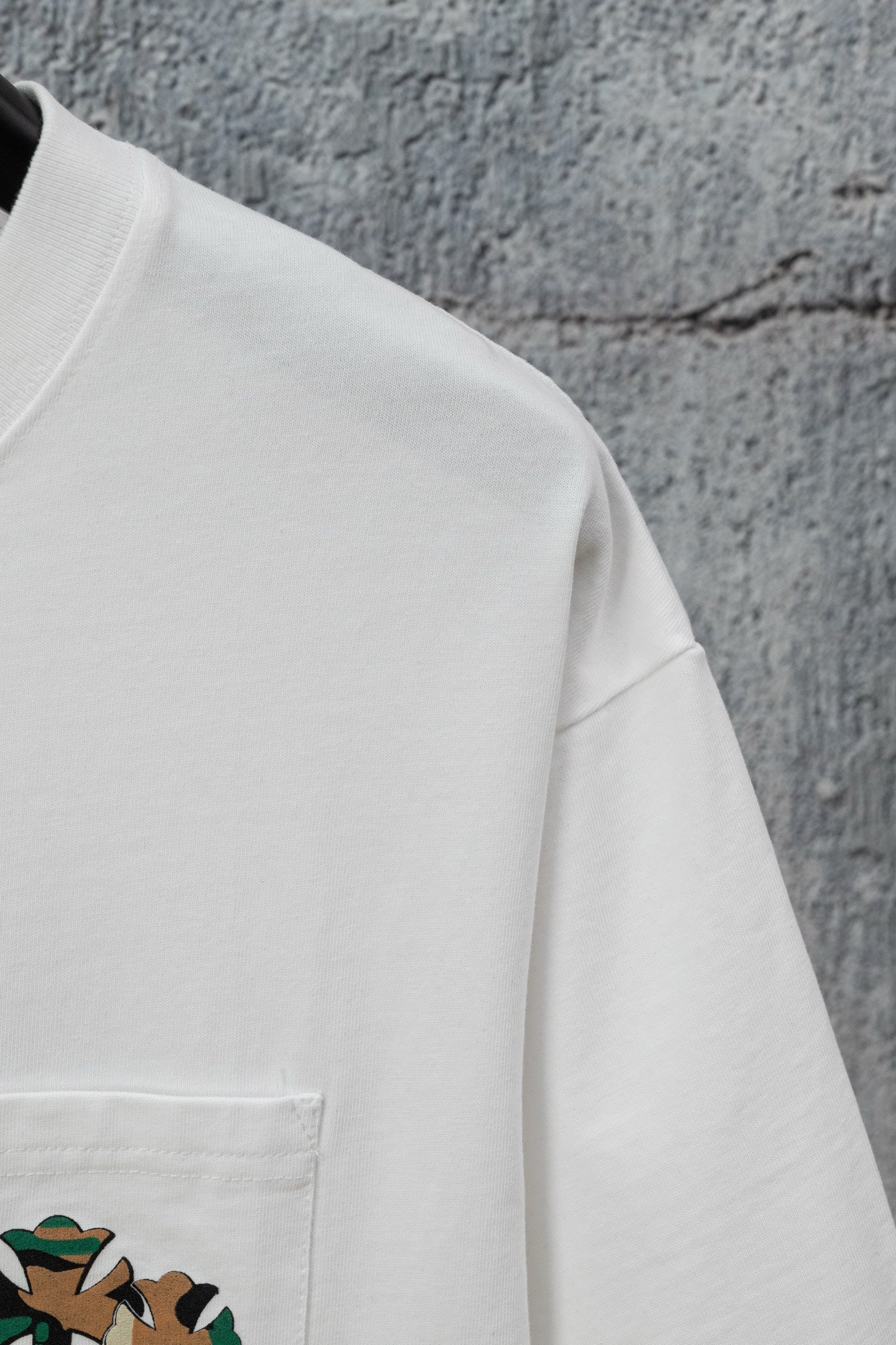 White T-shirt front with small left pocket graphic