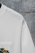 White short-sleeve T-shirt shoulder and side panel with small pocket graphic edge