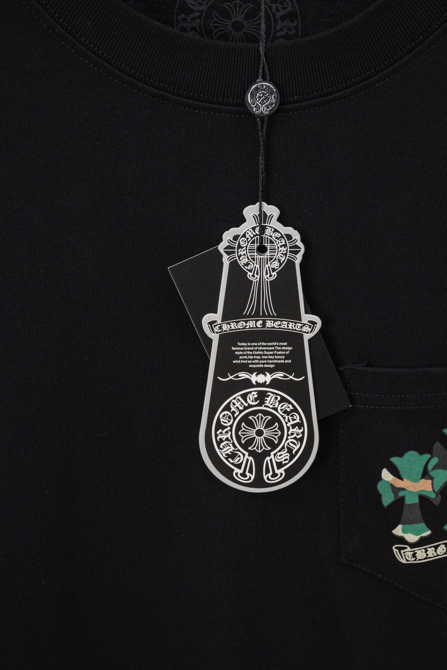 Black short-sleeve T-shirt with hanging tag and crest label