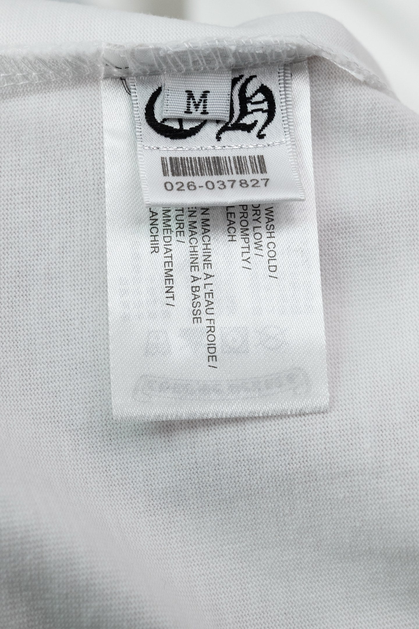 White T-shirt size label with care instructions