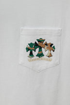 White T-shirt pocket with green and brown cartoon graphic