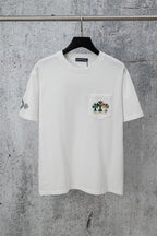 White short-sleeve T-shirt with pocket and small chest crest graphic