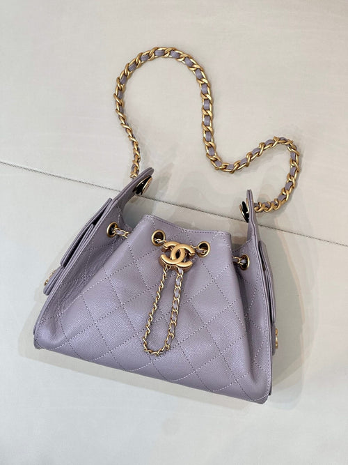 Lavender quilted handbag with gold chain shoulder strap and CC logo on front