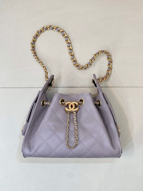 Lavender quilted top-handle bag with gold chain strap and small CC charm clasp