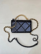 Chanel quilted mini crossbody bag with dark blue flap, diamond quilting, two-tone chain