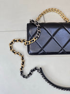Chanel quilted mini shoulder bag with dark blue diamond quilting and gold chain handle