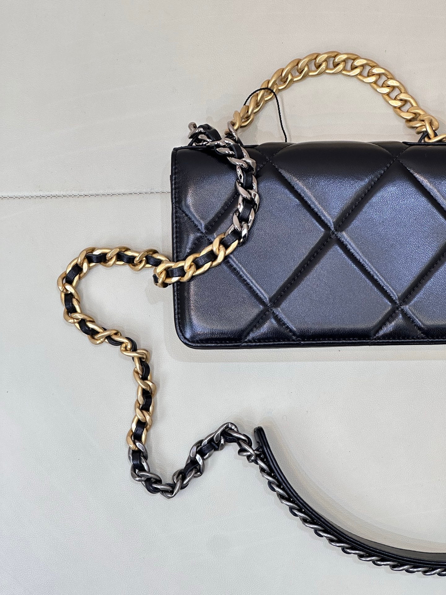 Chanel quilted mini shoulder bag with dark blue diamond quilting and gold chain handle