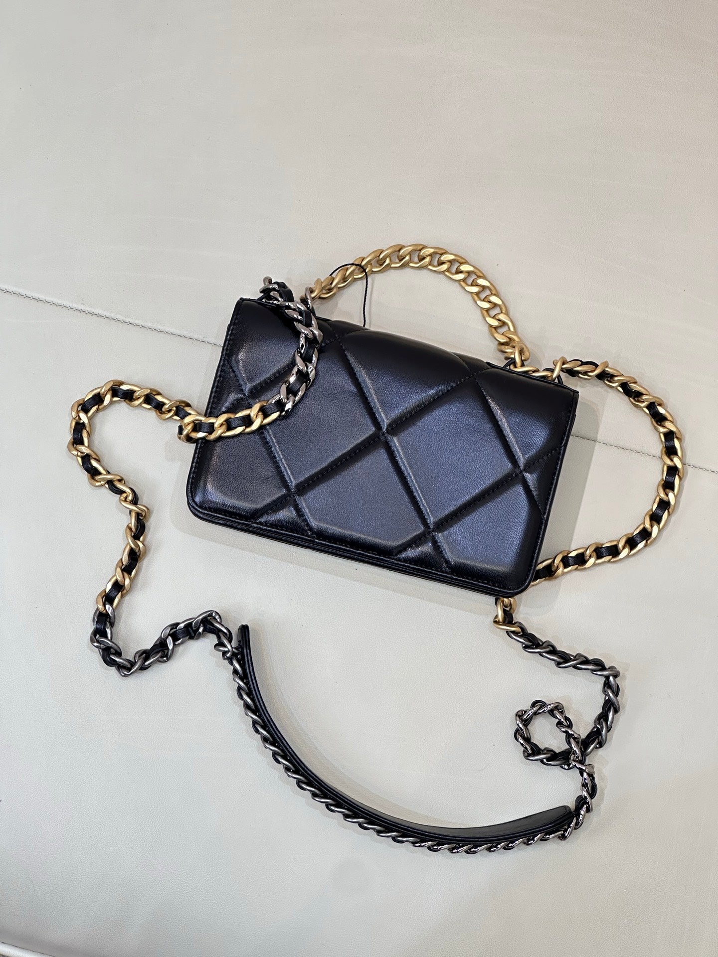 Chanel quilted mini crossbody bag with dark blue diamond panel and two-tone chain