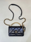 Chanel quilted mini shoulder bag with dark blue flap and gold/silver chain strap