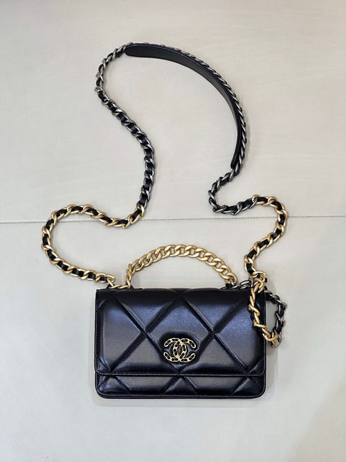 Chanel quilted mini shoulder bag with dark blue flap and gold/silver chain strap
